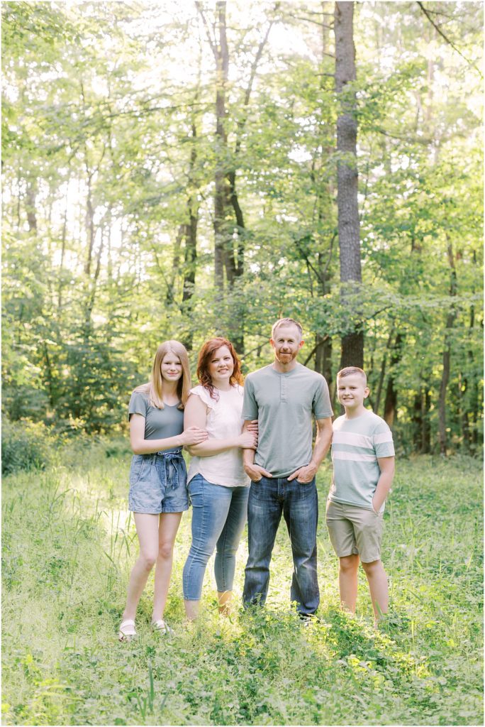 Mount Gretna family posing together in the woods