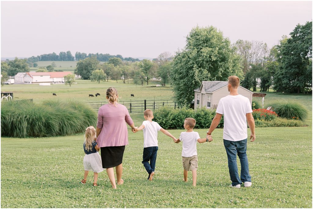 Family walking and overlooking their farm