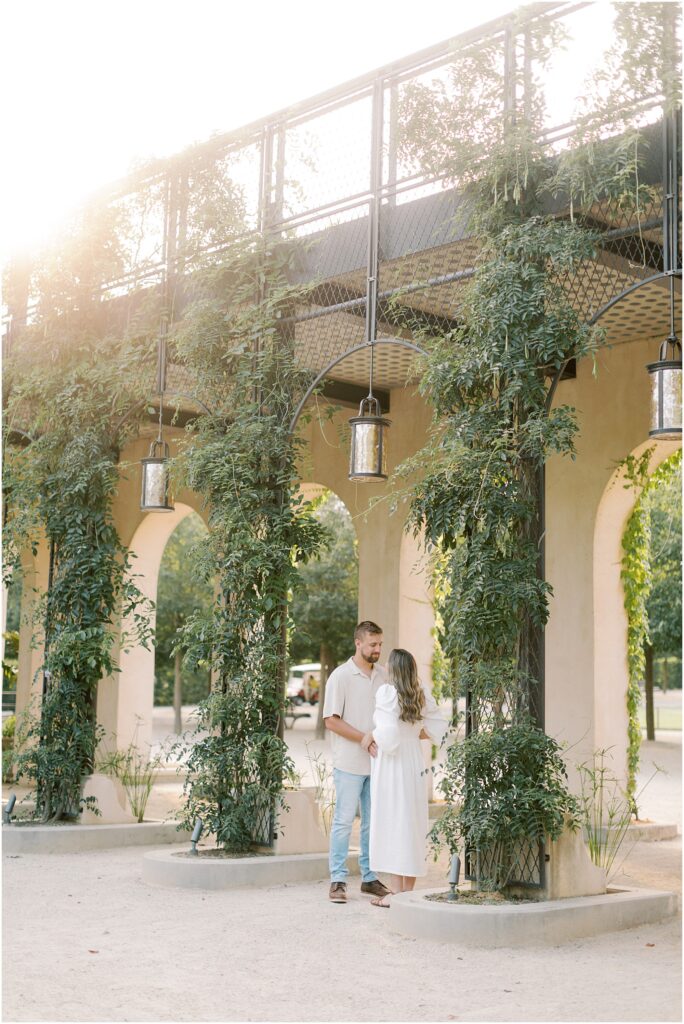 Couple standing near the arches at Longwood Gardens