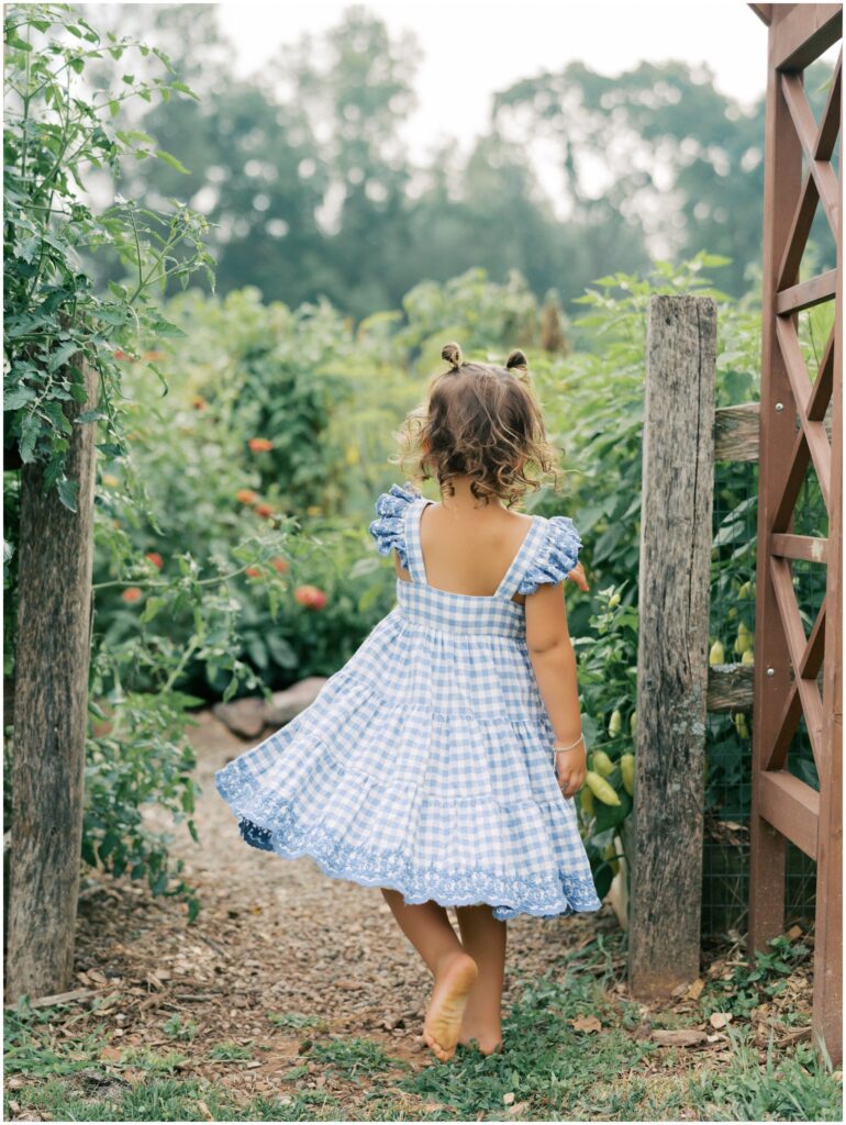 Child in backyard vegetable garden during Lancaster County family session.
