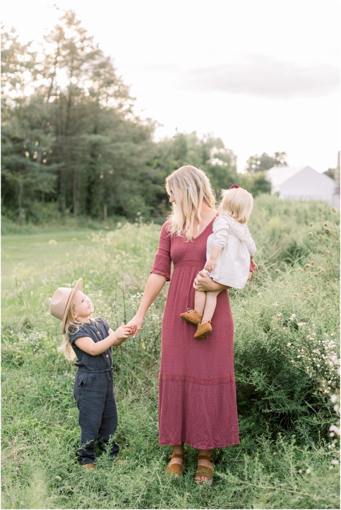 Momma in a field with her daughters