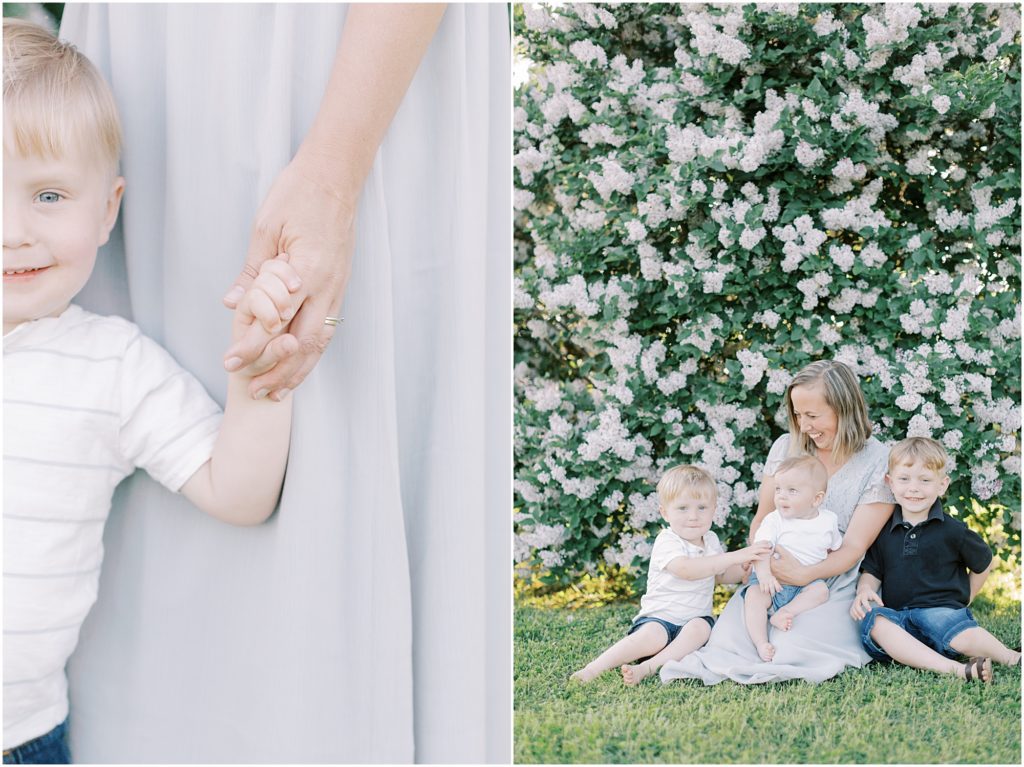 Mother with boys by lilac bush; child holding mother's hand at Lilac Mini Session