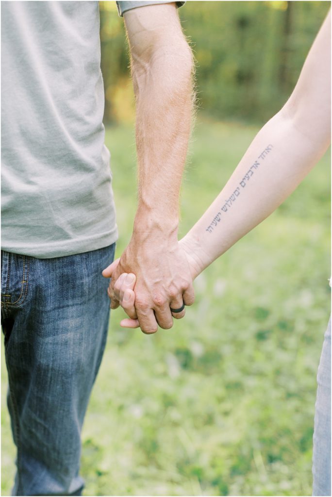 Couple holding hands during family session