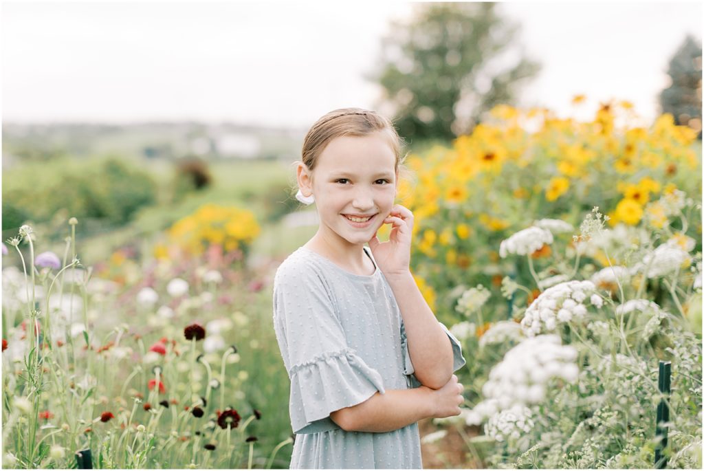 Young girl in flower garden