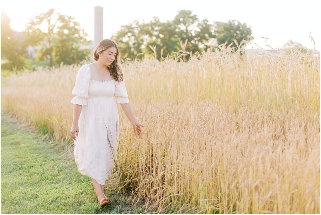 Woman walking next to the wheat field at Lititz Family Styled Session