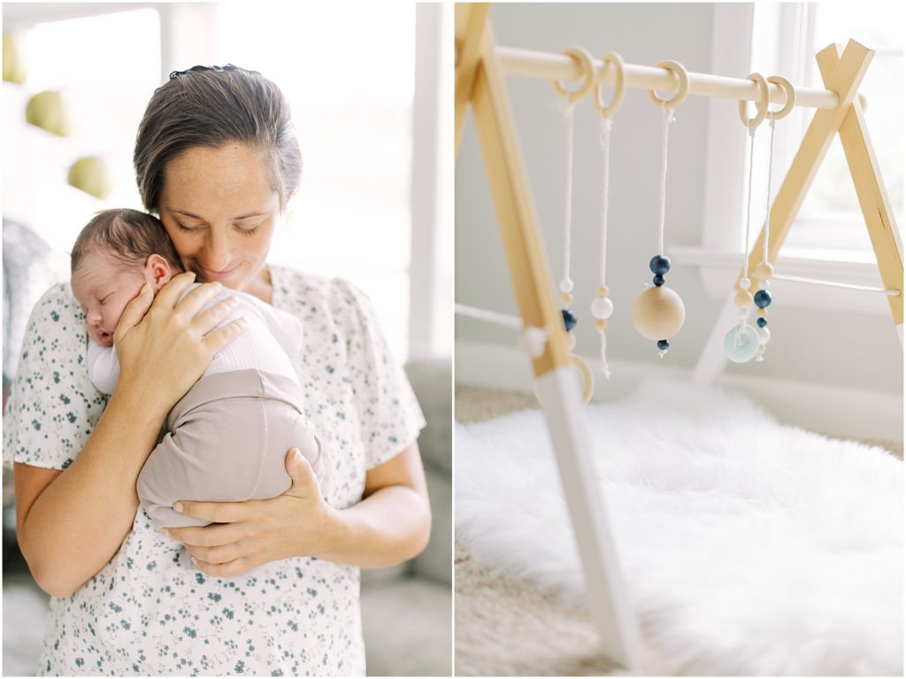 mama holding baby boy and wooden baby toy