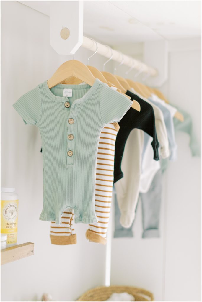 Boutique style clothes hanging in nursery summer indoor newborn session