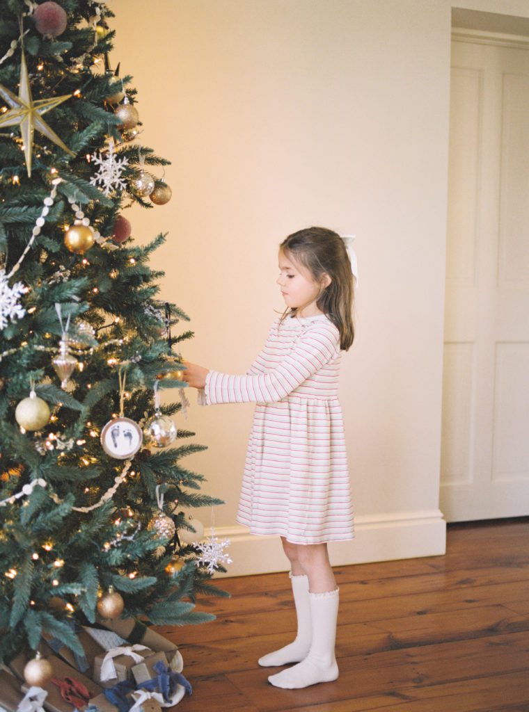 Little Girl decorating the tree with Angelique Jasmin Photography