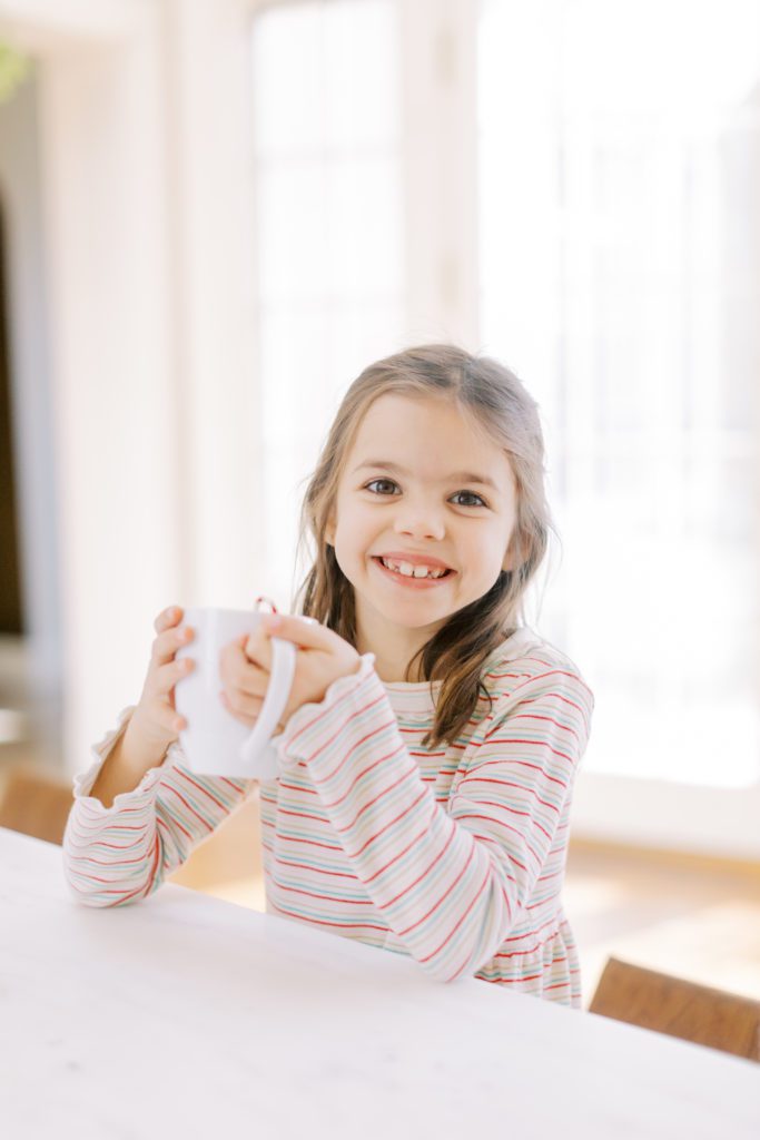 Little girl with hot cocoa at Christmas Lifestyle Session
