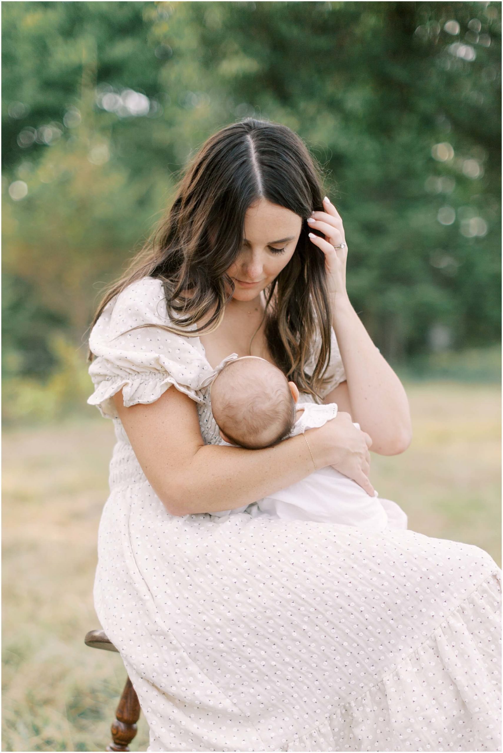 Mother breastfeeding her baby girl