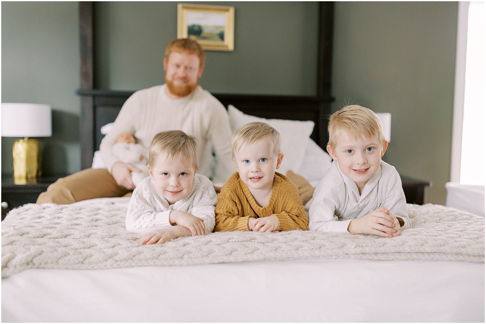 Boys on the bed at newborn session with boys