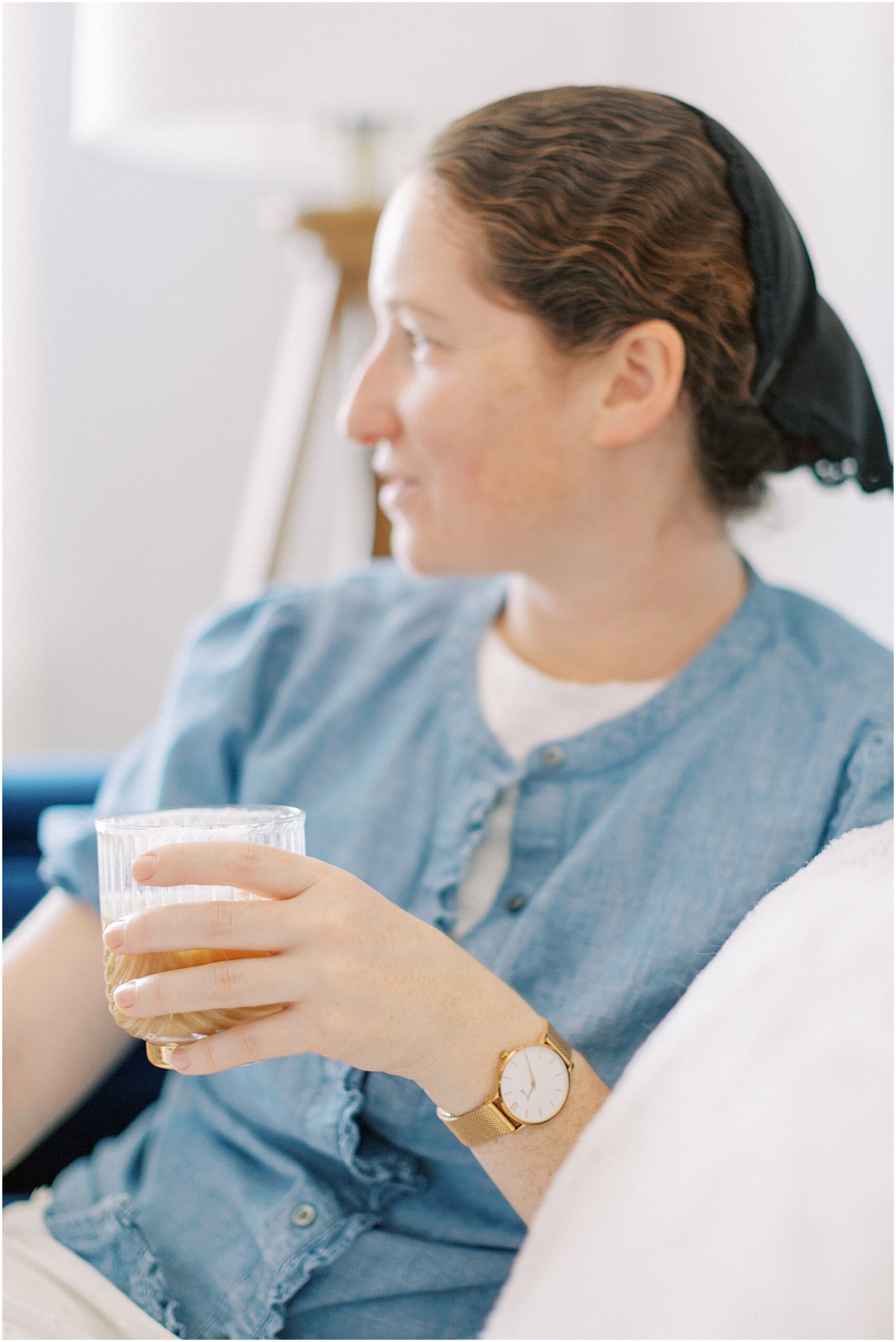 woman holding an iced coffee in friend in your corner
