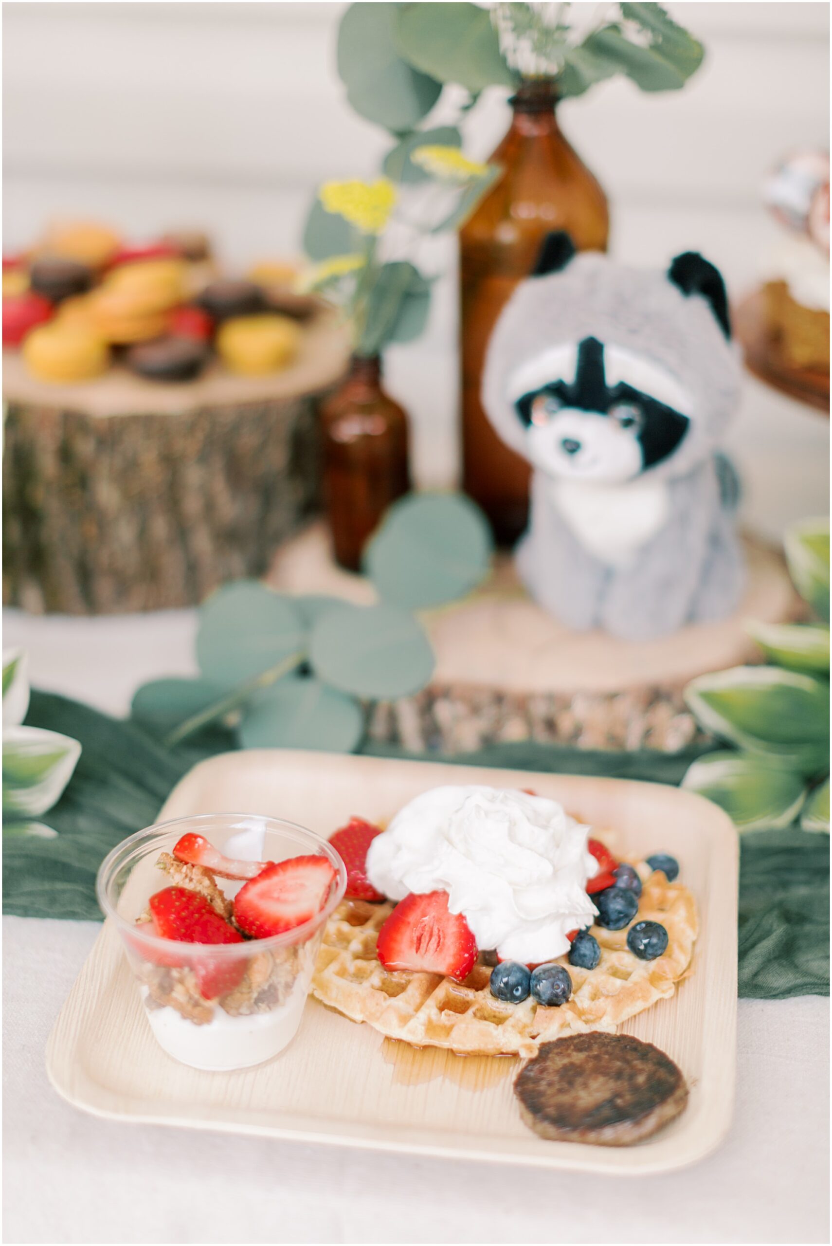 Plate of brunch food at woodland themed baby shower