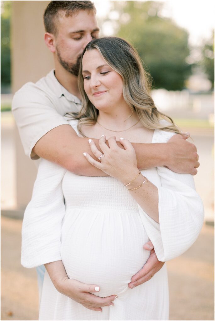Close up details of a couple embracing at a maternity session