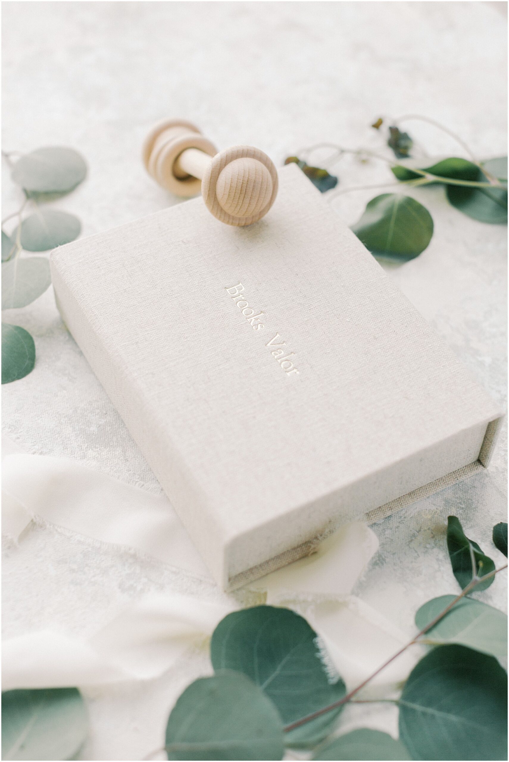 Details of a linen photo storage box on a newborn flat lay in Photography Print Products with Angelique Jasmin Photography