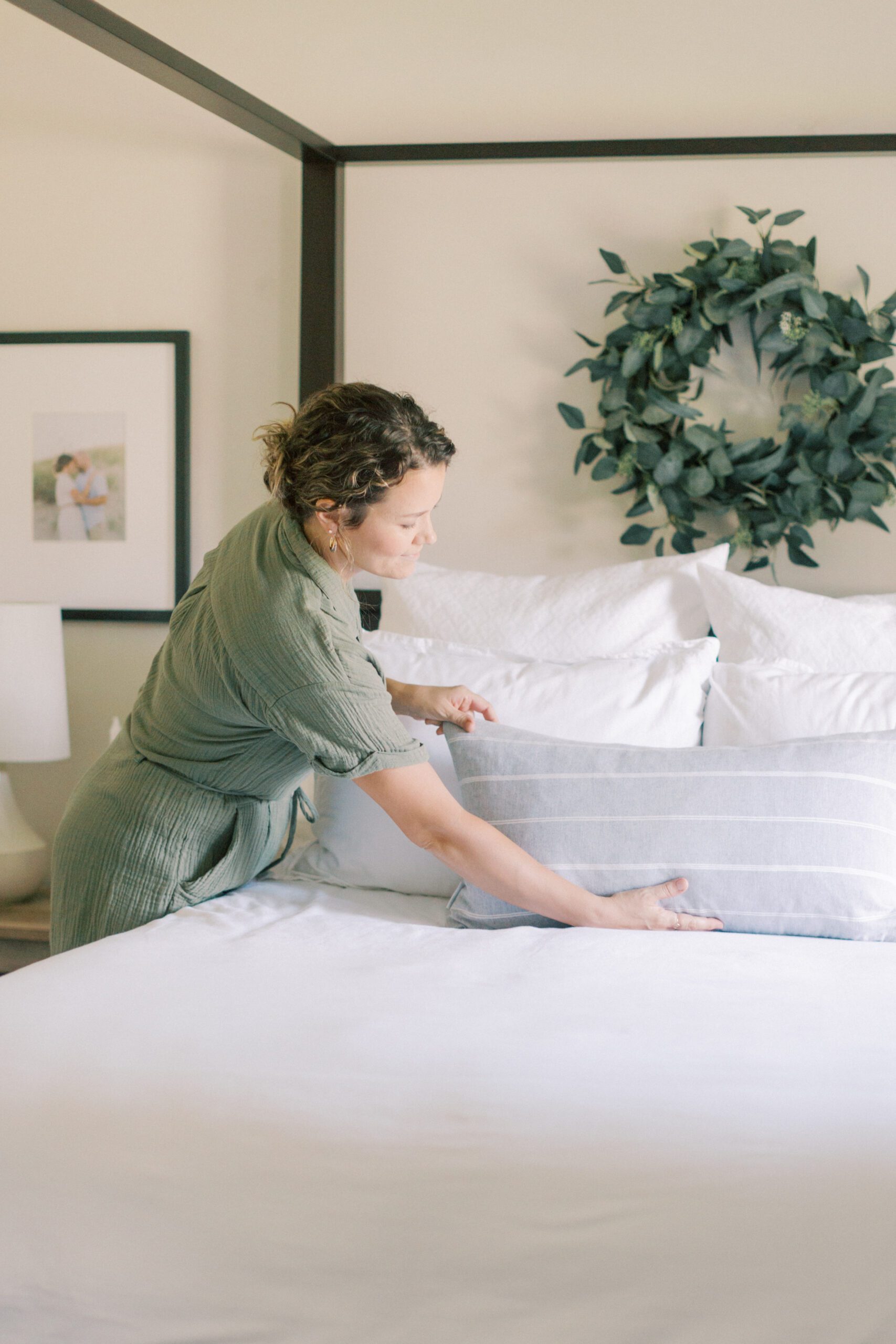 woman making her bed in how to successfully start your day