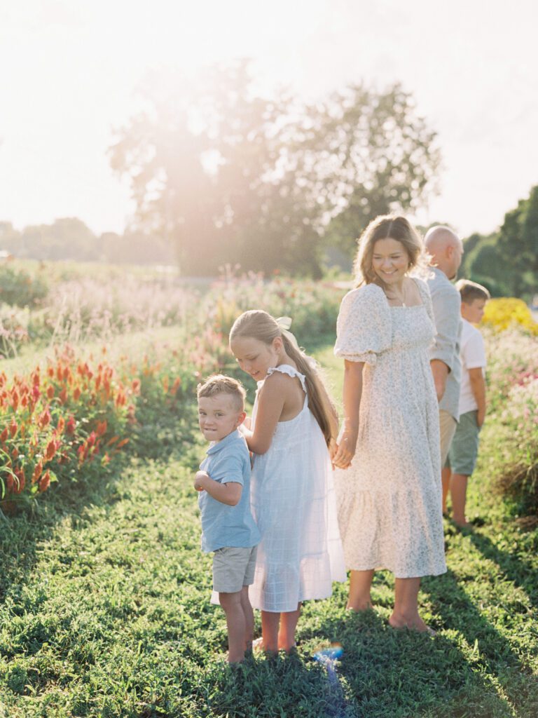 Family walking in a line through flower gardens in Things I'm Thankful for in 2023