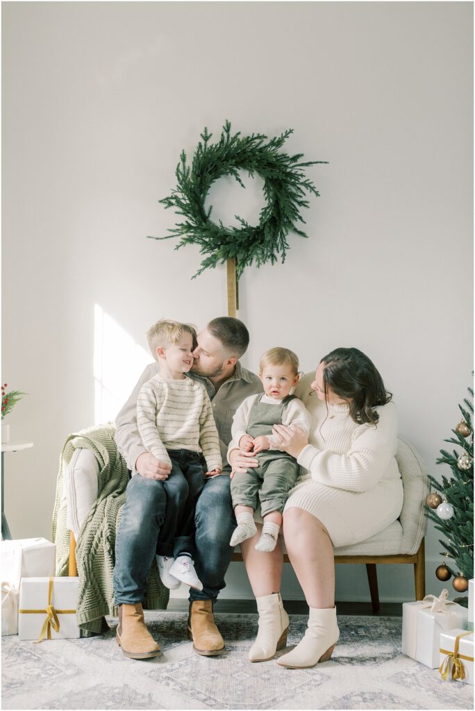 Family sitting together  on a couch at Lancaster, PA Christmas Mini Sessions