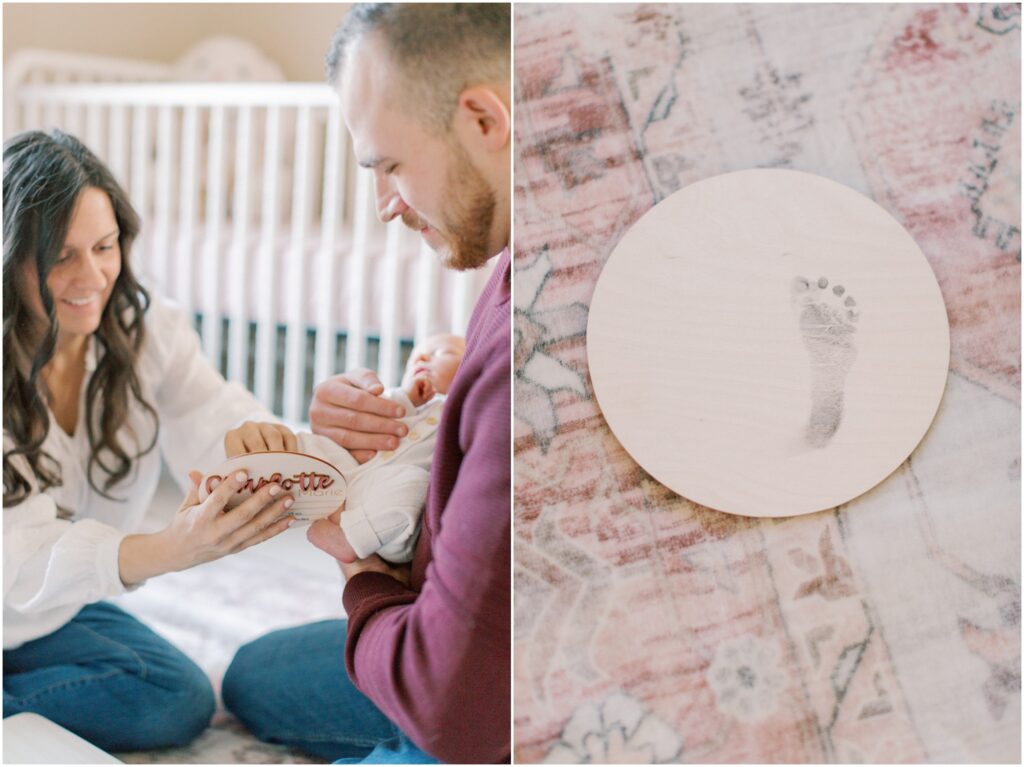 Parents imprinting newborn footprint on wooden