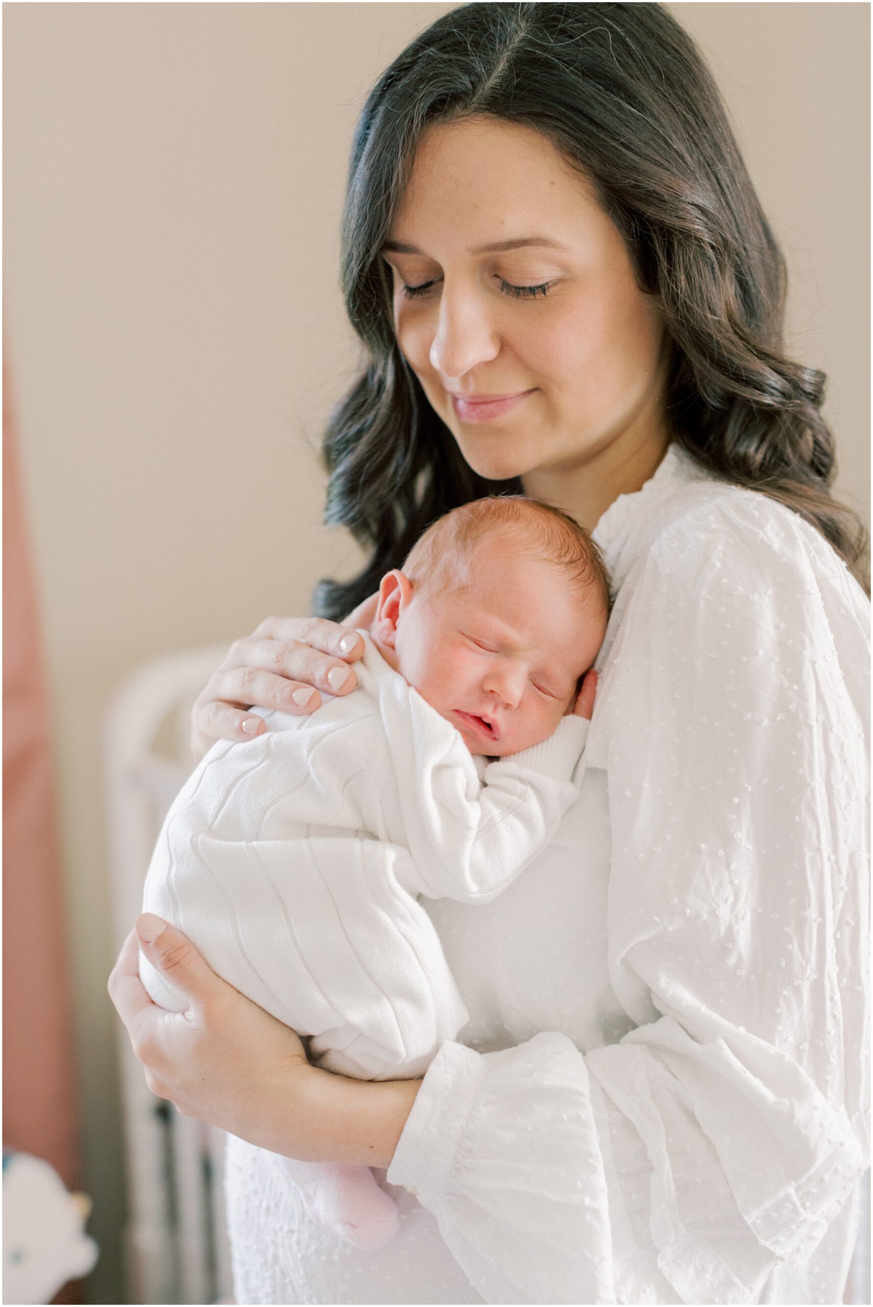 Mother holding her baby girl at at Central Pa Newborn Session with Angelique Jasmin Photography