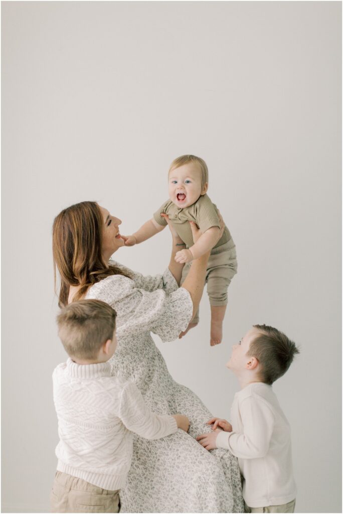 Mother with her boys at a First Birthday Session with Angelique Jasmin Photography