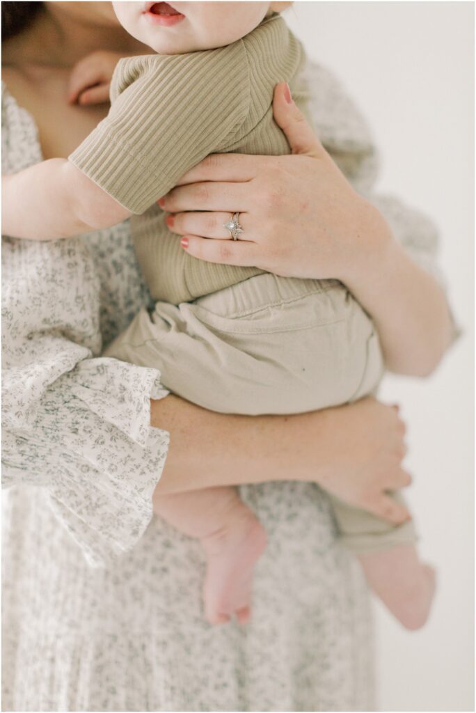 Mother's hands holding her toddler son with Angelique Jasmin Photography