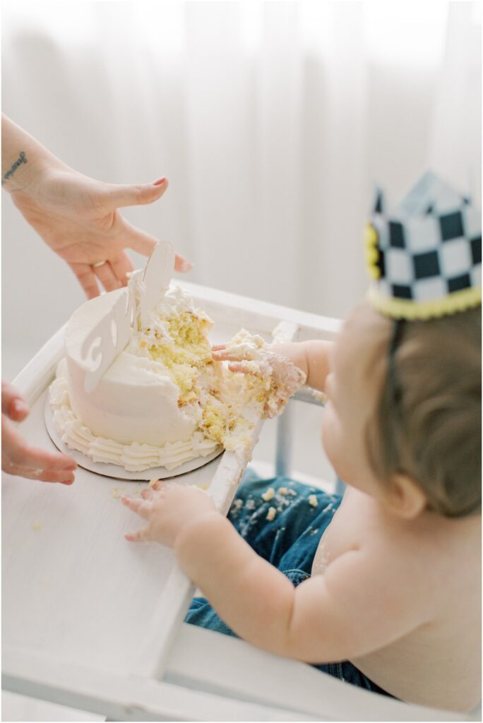 Cake handed to a toddler boy