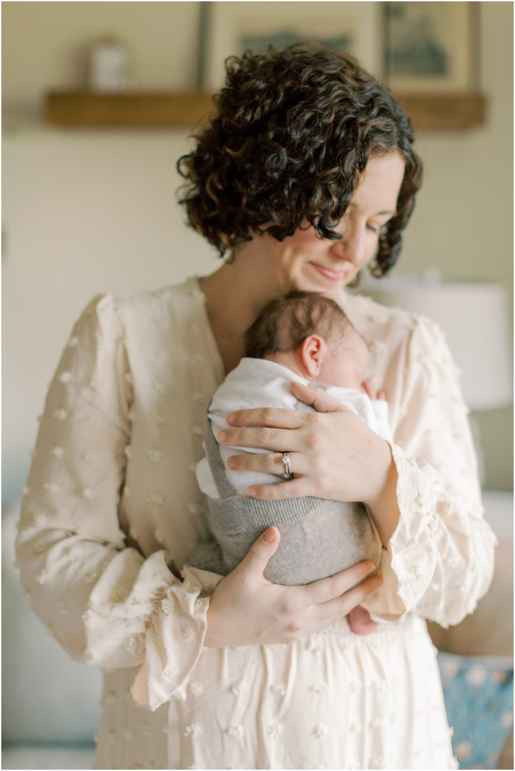 Mother with newborn in a winter newborn session Lancaster PA with Angelique Jasmin Photography